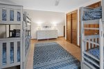 The bunk room features ample floor and closet space